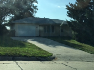 a house with a driveway in front of it